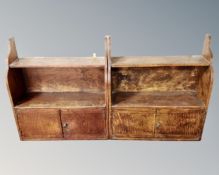 A pair of antique oak wall shelves fitted with double door cupboard