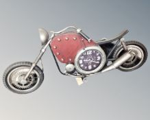 A metal contemporary wall clock in the form of a chopper bike