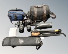 A Canon EOS 100D digital camera body, together with three Canon lenses (EFS18 - 200 mm,