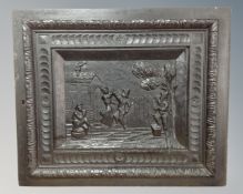 A heavily carved and ebonised oak wall panel