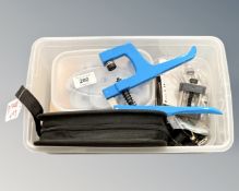 A collection of horologist's tools : Clamps, precision screwdrivers, eye loop, etc.