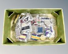 A quantity of copy medals on ribbons.