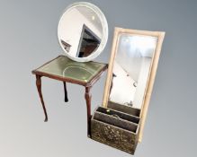 A stained beech occasional table with leather inset panel and glass top together with two wall