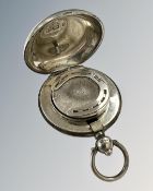 A silver sovereign case,