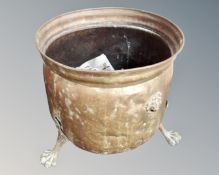 A Victorian copper lion mask coal bucket on raised paw feet