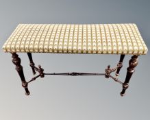 A rectangular window seat in studded tapestry upholstery with turned beech understretcher (length