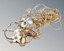 A lot of yellow metal chains and enamelled flowers