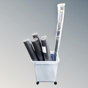 A plastic storage crate on wheels containing five Vibrapower mats together with a body blade with