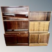 Two continental storage cabinets with shelves above and cupboards in base.