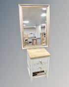 An Ercol Pinto two drawer bedside cabinet together with a contemporary bevelled mirror