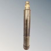 An antique brass nautical telescope.