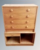 A teak chest of four drawers together with small unit.