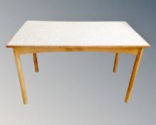 A mid-20th century melamine topped kitchen table.