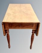 A 19th century mahogany flapsided table.
