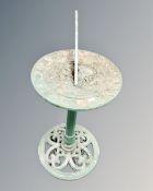 A cast iron sundial on pedestal.