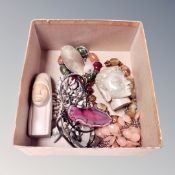 A small collection of carved minerals including African head, Buddha head, a Chinese keyring,