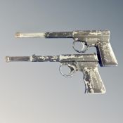 Two Gat air pistols.