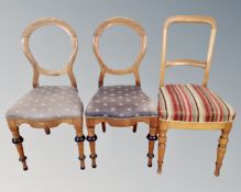 A pair of antique oak bedroom chairs together with a further single chair.