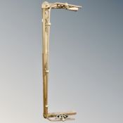 A Victorian brass extending fire curb