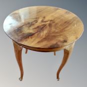 A continental mahogany circular table together with a further two tier circular table.