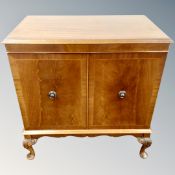 A Charles Sheraton audio cabinet on raised legs