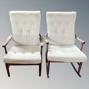 A mid-20th century stained beech upholstered rocking chair together with a matching armchair.