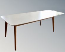 A 20th century light oak veneered dining room top with white veneered top and extension leaves.