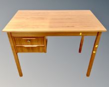 A 20th century Scandinavian teak writing desk fitted with two drawers,
