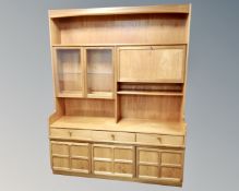 A 20th century Nathan teak cocktail wall unit fitted with cupboards and drawers,