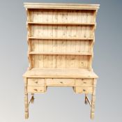 An antique pine kitchen dresser fitted with five drawers,