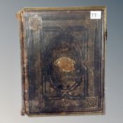 A 19th century leather bound family bible with colour lithographic book plates.