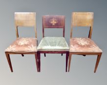 Three inlaid mahogany continental dining room chairs.