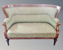 A 19th century inlaid mahogany three seater settee upholstered in tow tone green fabric.