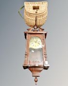 A C Wood & Son eight day wall clock together with a vintage fishing creel.