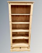 A set of pine open bookshelves,