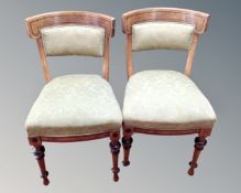 A pair of 19th century inlaid mahogany dining chairs.