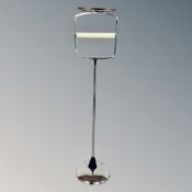 A chrome Art Deco toilet roll holder.