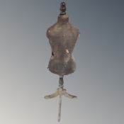 A vintage child's mannequin on stand