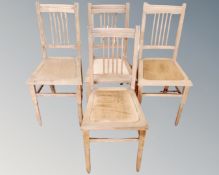 A set of four beech rail backed dining room chairs.