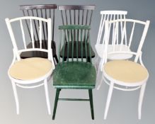 Seven assorted painted dining room chairs.
