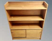 A set of 20th century teak open bookshelves,