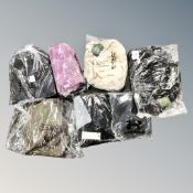 A box containing Regatta and Under Armour lady's coats, sleeping bag and backpack, new and tagged.