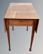 An early 20th century mahogany flapsided table.