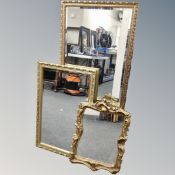 Three gilt framed mirrors.