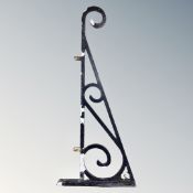 An antique cast iron wall bracket.