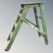 A mid-20th century wooden folding step/platform.