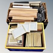 Two boxes of pictures frames, sealed and new.