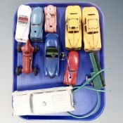 A tray containing mid-20th century plastic and tin plate vehicles including Schuco racing car.