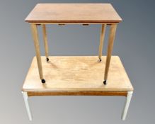A 20th Century Nathan teak coffee table on painted legs together with a further teak occasional