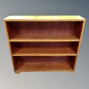 A set of mid-20th century open bookshelves.